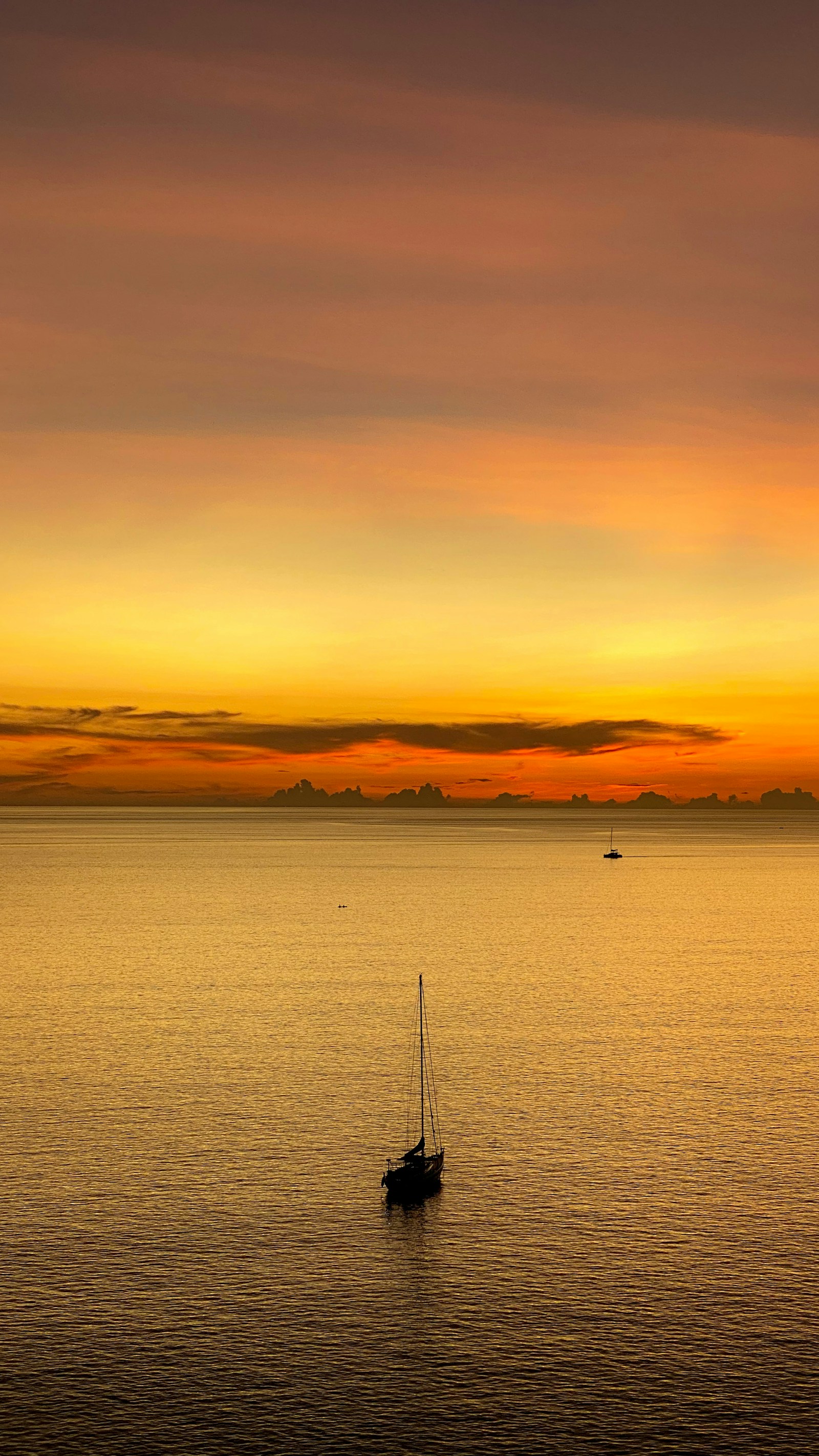 Sunset over Nai Harn Beach and the Andaman Sea