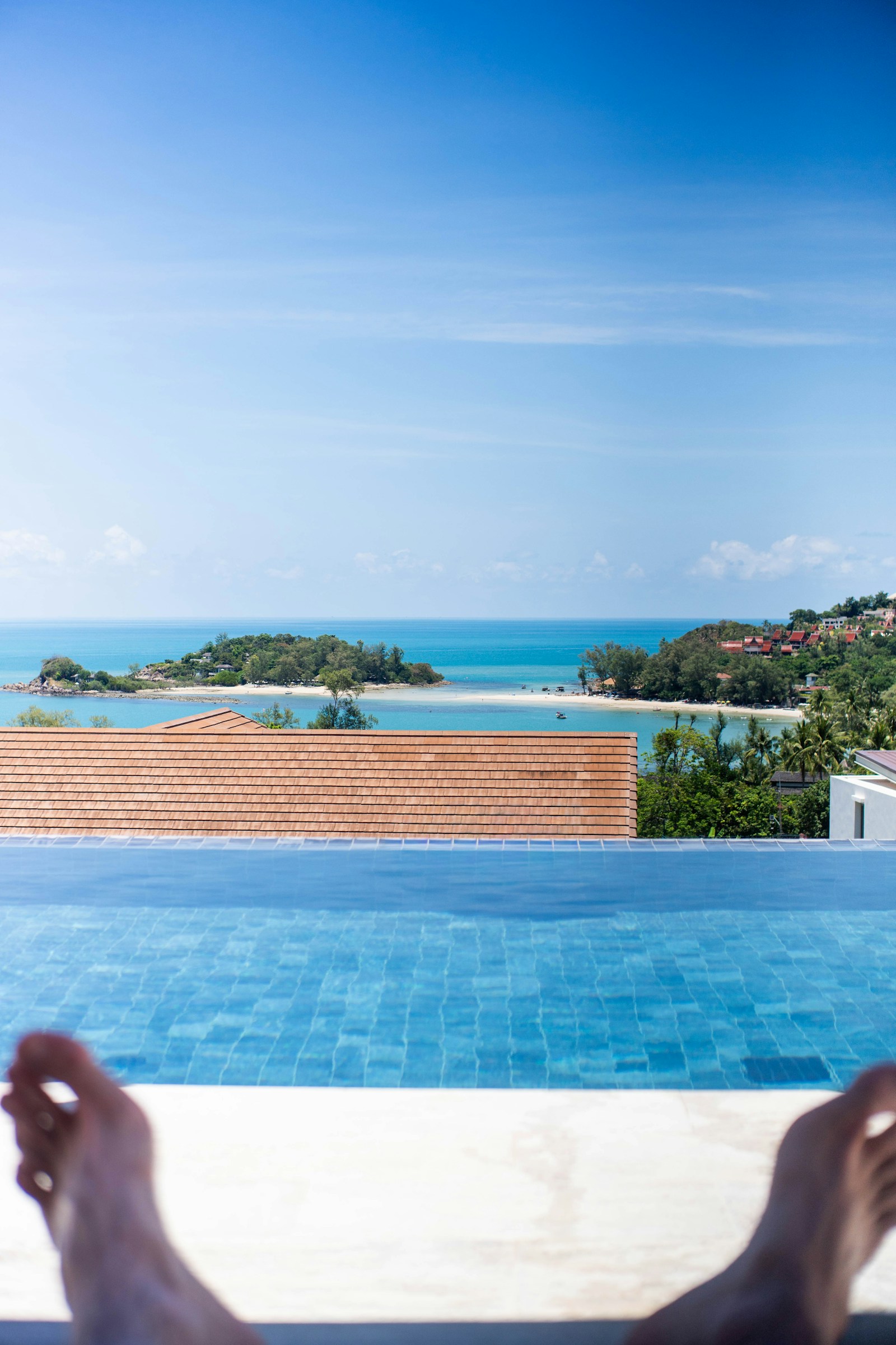 Luxury infinity pool overlooking a tropical bay